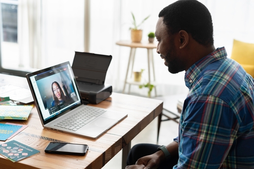 man video chatting at work.