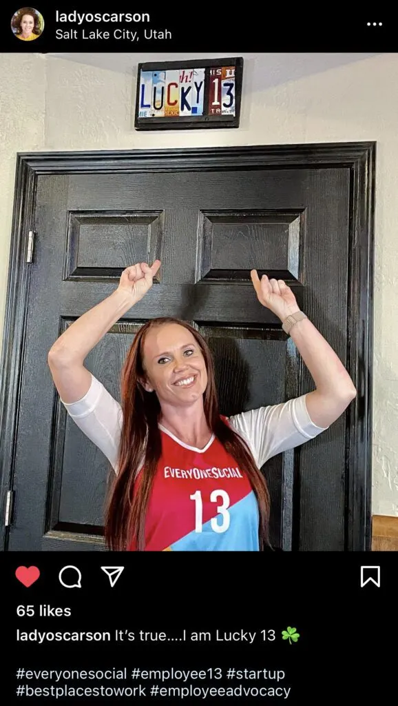 EveryoneSocial employee wearing her personalized company-branded jersey.